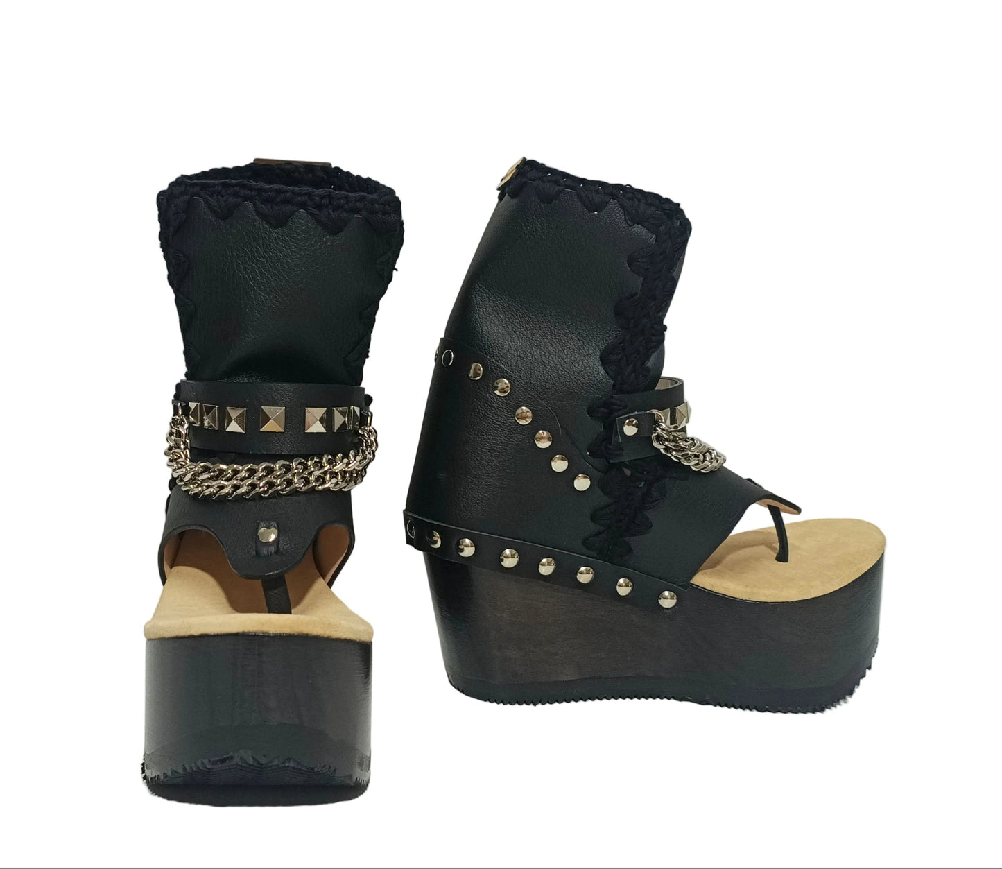 Sol Caleyo Texas Boots: Handcrafted black leather platform flip-flop sandals with wooden wedge heel, silver pyramid studs, and decorative chains. 9cm heel with zig-zag rubber traction sole.