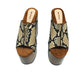 Handcrafted Snake Luxury Queen Sandals by Sol Caleyo featuring exotic snake-print leather, 17cm bell heel, and 11cm hand-carved wooden platform on a white background.