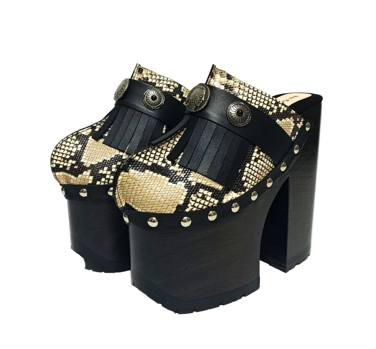 Indian Snake Clogs by Sol Caleyo: extreme 18cm straight heel wooden platforms with snake-print leather, black fringe, and Native American style metal conchos.