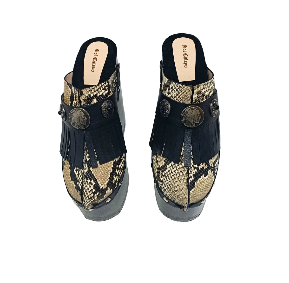 Indian Snake Clogs by Sol Caleyo: extreme 18cm straight heel wooden platforms with snake-print leather, black fringe, and Native American style metal conchos.