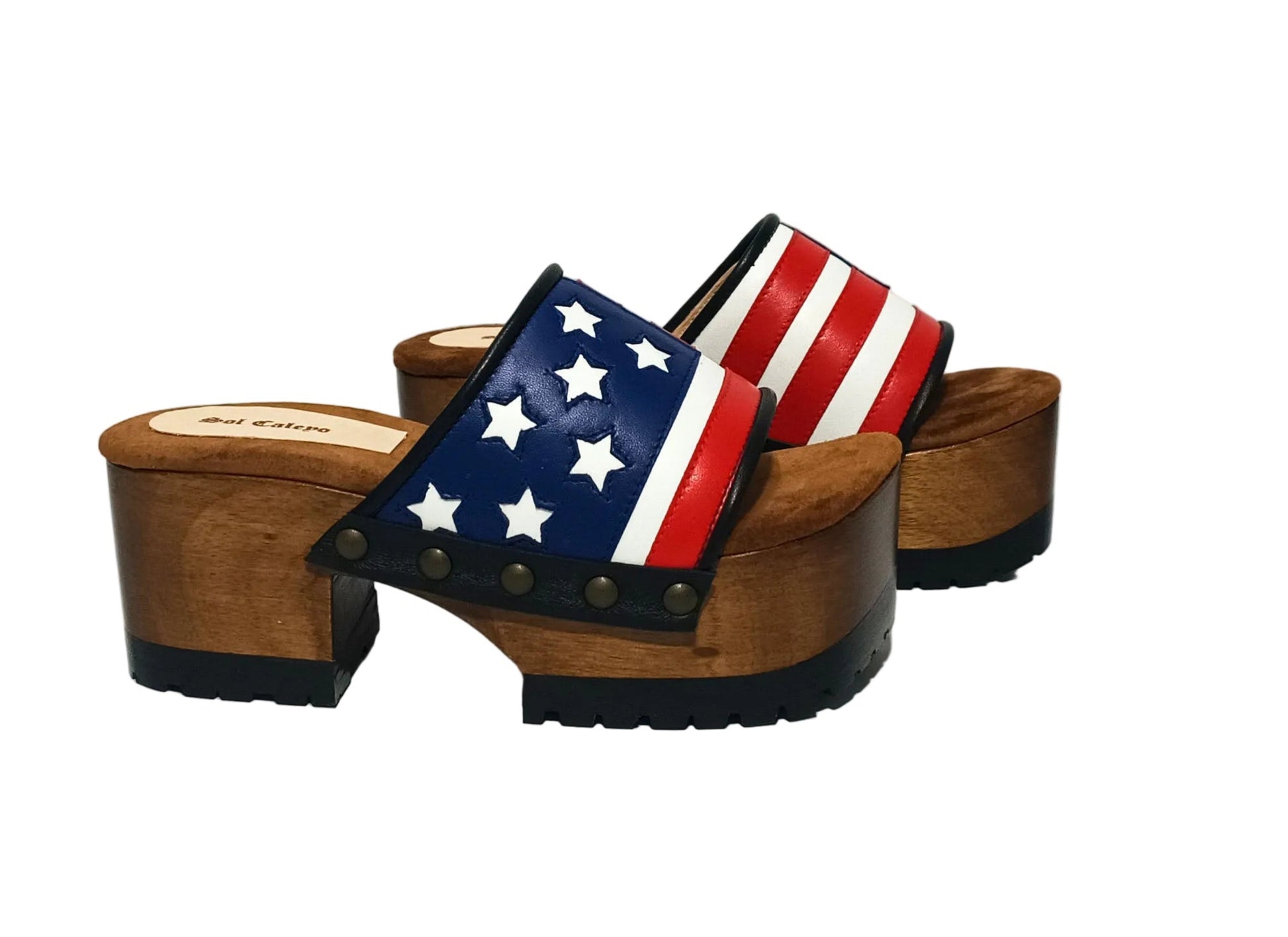 American Sandals XS by Sol Caleyo: close-up of handmade wooden platform sandals with USA flag leather strap and studs.