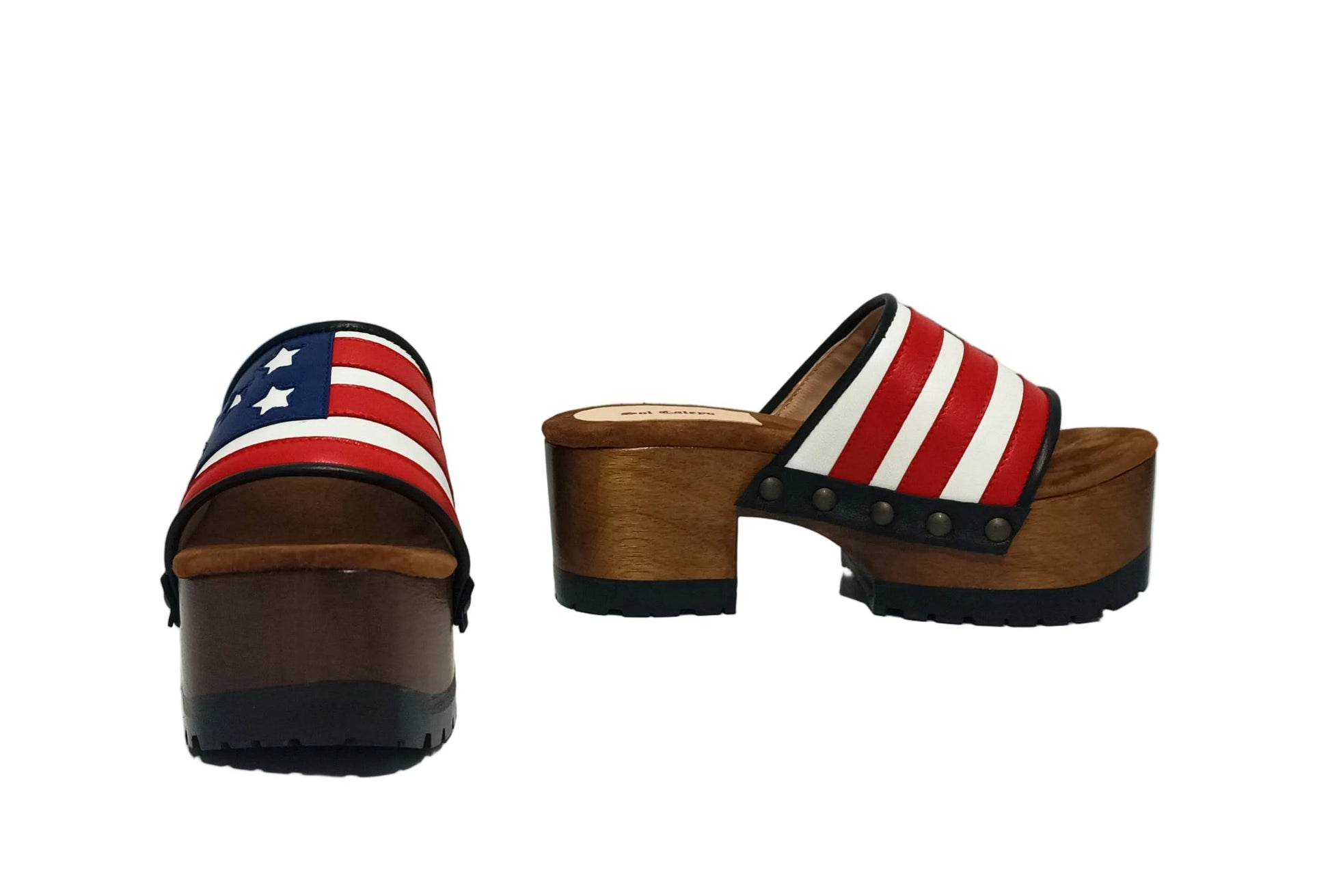 American Sandals XS by Sol Caleyo: close-up of handmade wooden platform sandals with USA flag leather strap and studs.