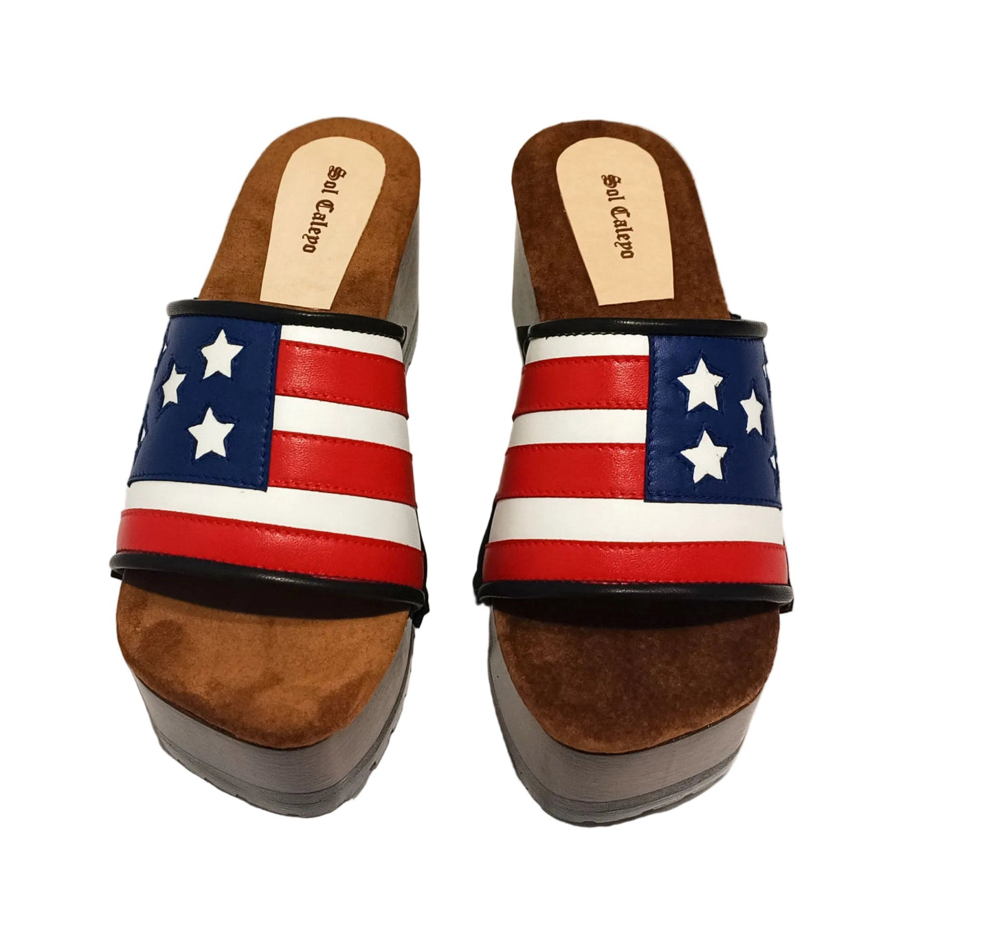 American Sandals XS by Sol Caleyo: close-up of handmade wooden platform sandals with USA flag leather strap and studs.