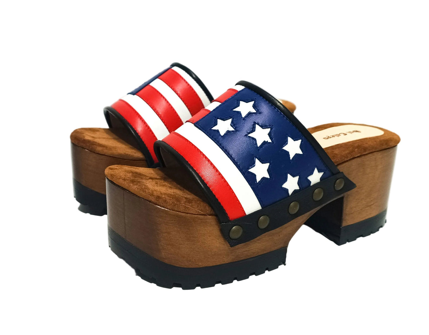 American Sandals XS by Sol Caleyo: close-up of handmade wooden platform sandals with USA flag leather strap and studs.