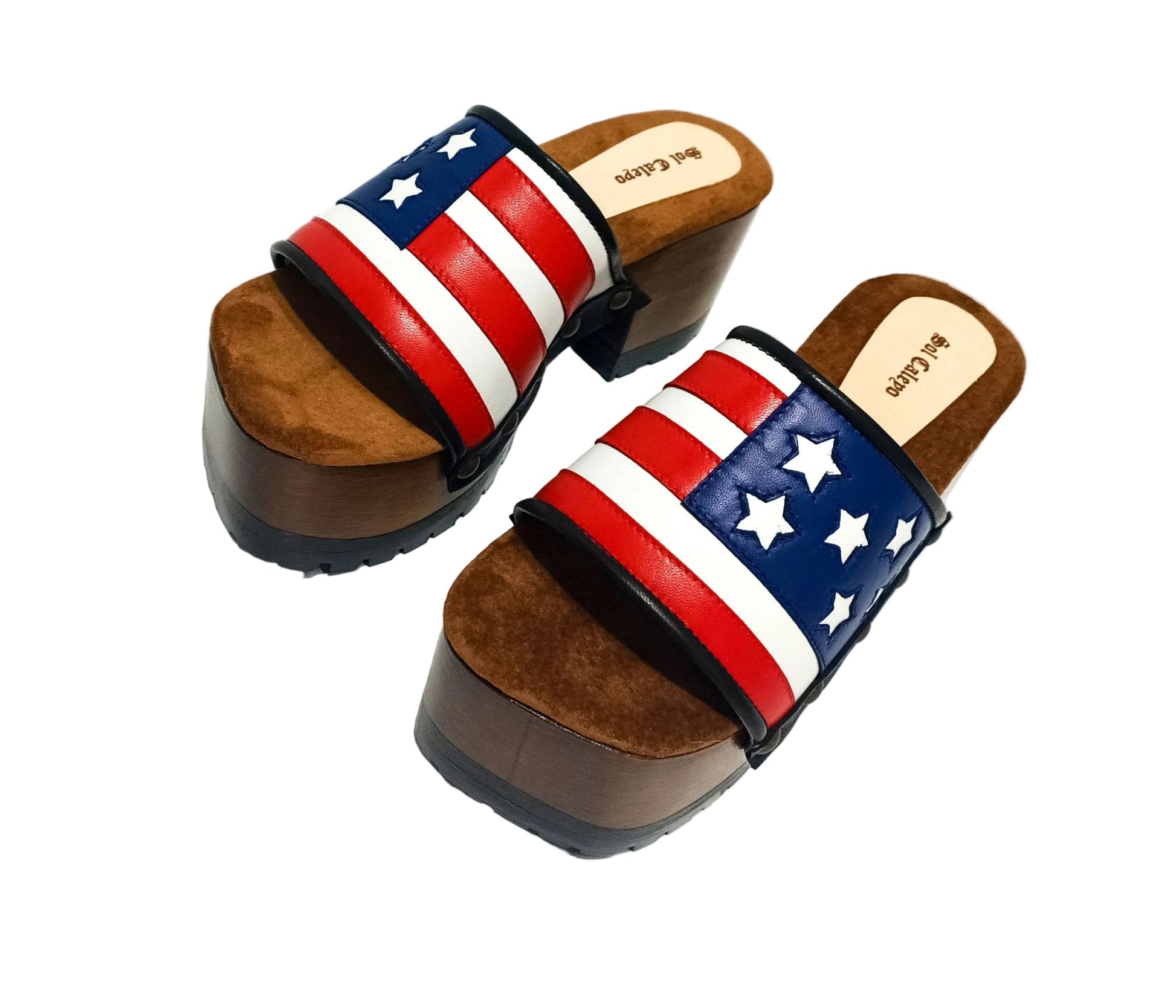 American Sandals XS by Sol Caleyo: close-up of handmade wooden platform sandals with USA flag leather strap and studs.