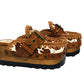 Oxford Clogs Cowhide Print by Sol Caleyo: handmade wooden platform clogs with cowhide hair-on leather, crochet trim, and aged camel leather strap.