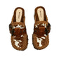Oxford Clogs Cowhide Print by Sol Caleyo: handmade wooden platform clogs with cowhide hair-on leather, crochet trim, and aged camel leather strap.