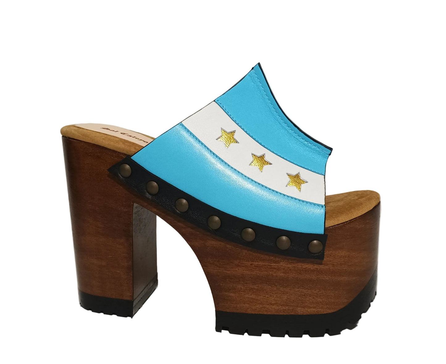 Pair of Sol Caleyo Argentina Sandals featuring a handcrafted wooden block heel and platform, a blue and white leather strap designed as the Argentine flag with three gold stars, and antique gold studs.
