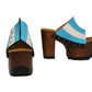 Pair of Sol Caleyo Argentina Sandals featuring a handcrafted wooden block heel and platform, a blue and white leather strap designed as the Argentine flag with three gold stars, and antique gold studs.