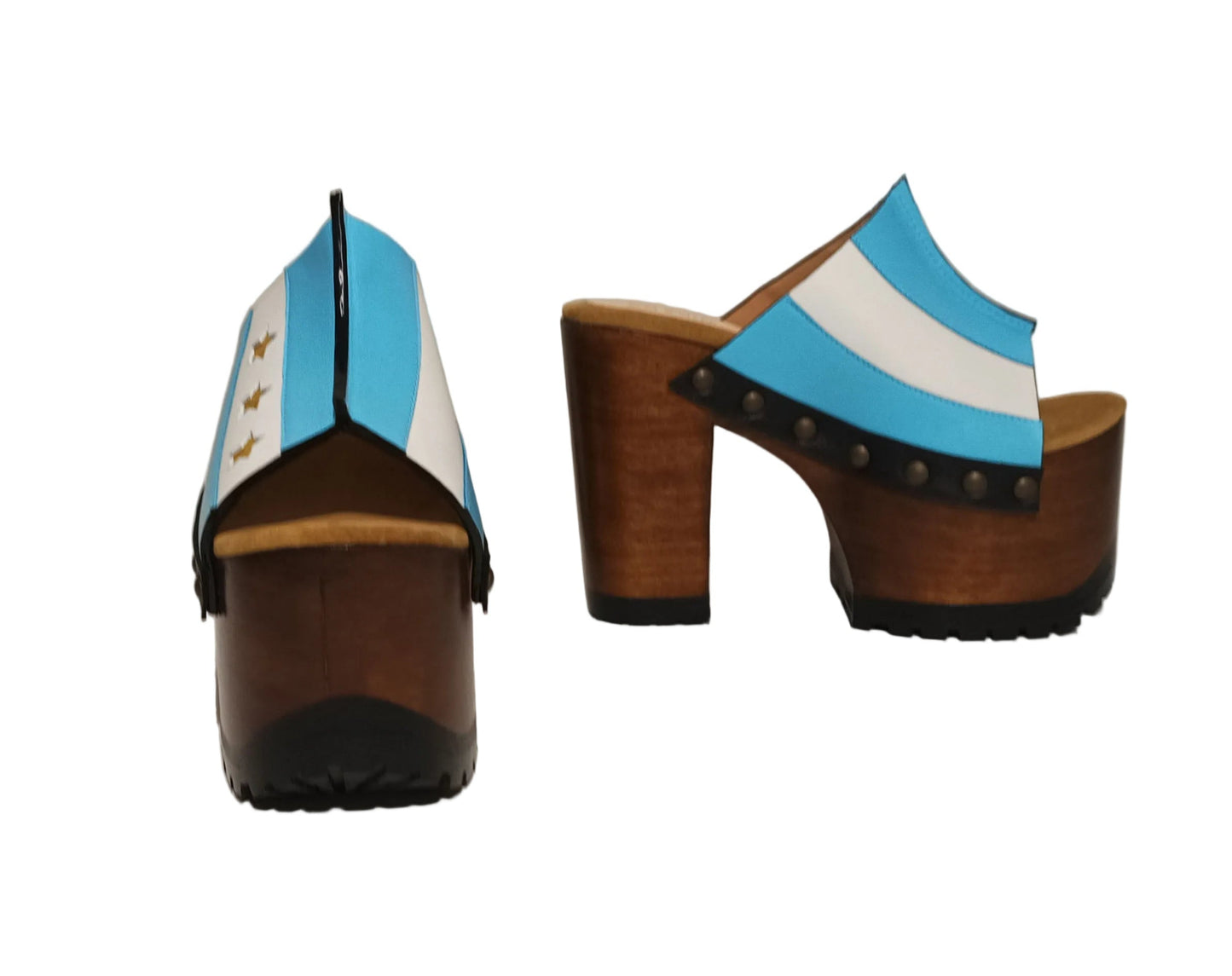 Pair of Sol Caleyo Argentina Sandals featuring a handcrafted wooden block heel and platform, a blue and white leather strap designed as the Argentine flag with three gold stars, and antique gold studs.