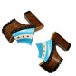 Pair of Sol Caleyo Argentina Sandals featuring a handcrafted wooden block heel and platform, a blue and white leather strap designed as the Argentine flag with three gold stars, and antique gold studs.