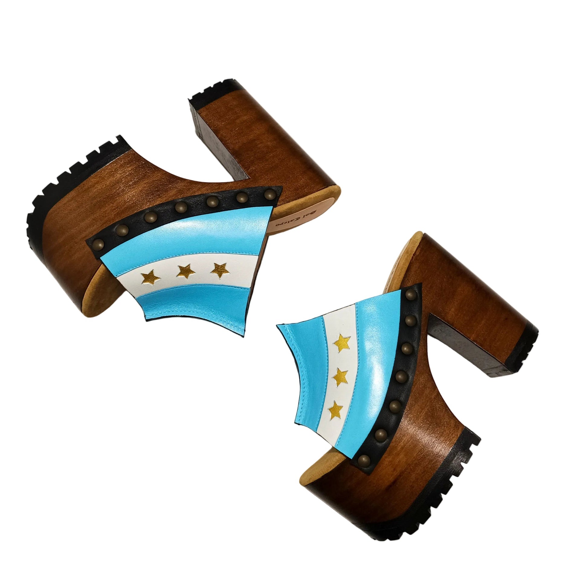 Pair of Sol Caleyo Argentina Sandals featuring a handcrafted wooden block heel and platform, a blue and white leather strap designed as the Argentine flag with three gold stars, and antique gold studs.