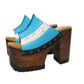 Pair of Sol Caleyo Argentina Sandals featuring a handcrafted wooden block heel and platform, a blue and white leather strap designed as the Argentine flag with three gold stars, and antique gold studs.