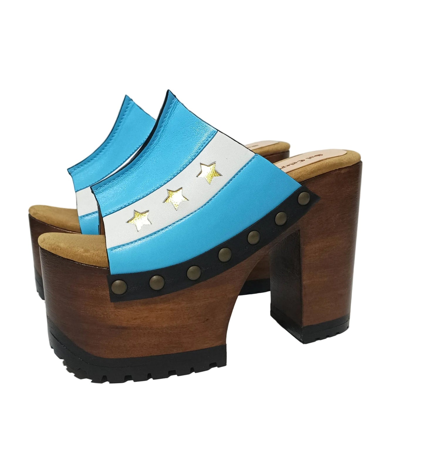 Pair of Sol Caleyo Argentina Sandals featuring a handcrafted wooden block heel and platform, a blue and white leather strap designed as the Argentine flag with three gold stars, and antique gold studs.