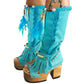 Turquoise bohemian-style boots, handmade. Platform boots with wooden heel. Turquoise bohemian-style boots decorated with feathers, shells and carved bone. High-end footwear handmade by Sol Caleyo.