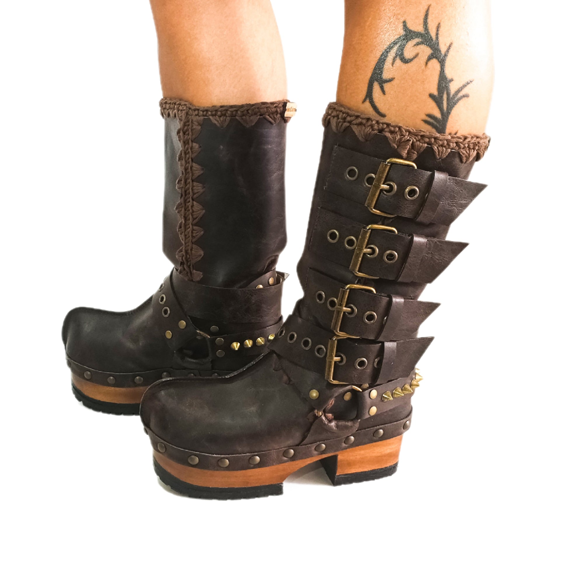 Handmade leather clogs. Dark brown leather biker boots. Leather boots with wooden heels. Leather boots with buckles. High-end footwear handmade by Sol Caleyo.