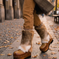 Person wearing handmade beige leather and fur platform boots, showing fit and bohemian style.