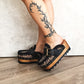 Handmade leopard print leather wedge mule clogs with old-gold buckle, studs and 6 cm wooden wedge by Sol Caleyo.
