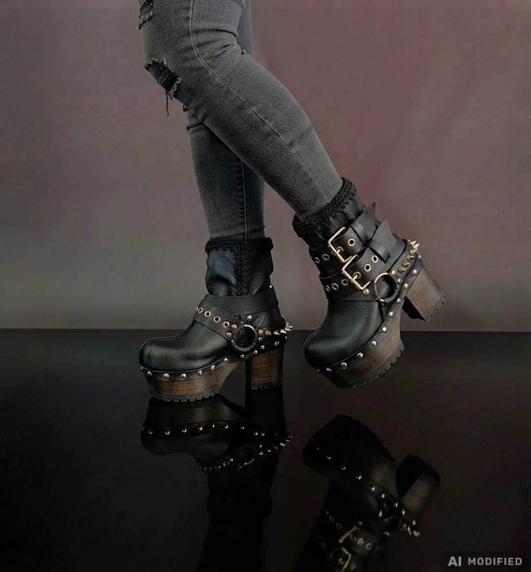 Black leather platform boots with silver studs. Black leather biker style boots with buckles. Black leather ankle boots with vintage style buckles. Leather boots with wooden heel. High-end handmade footwear by Sol Caleyo.