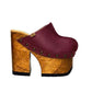 “Blue Jeans” Clogs by Sol Caleyo: side view of Bordeaux-colored leather platform clogs.