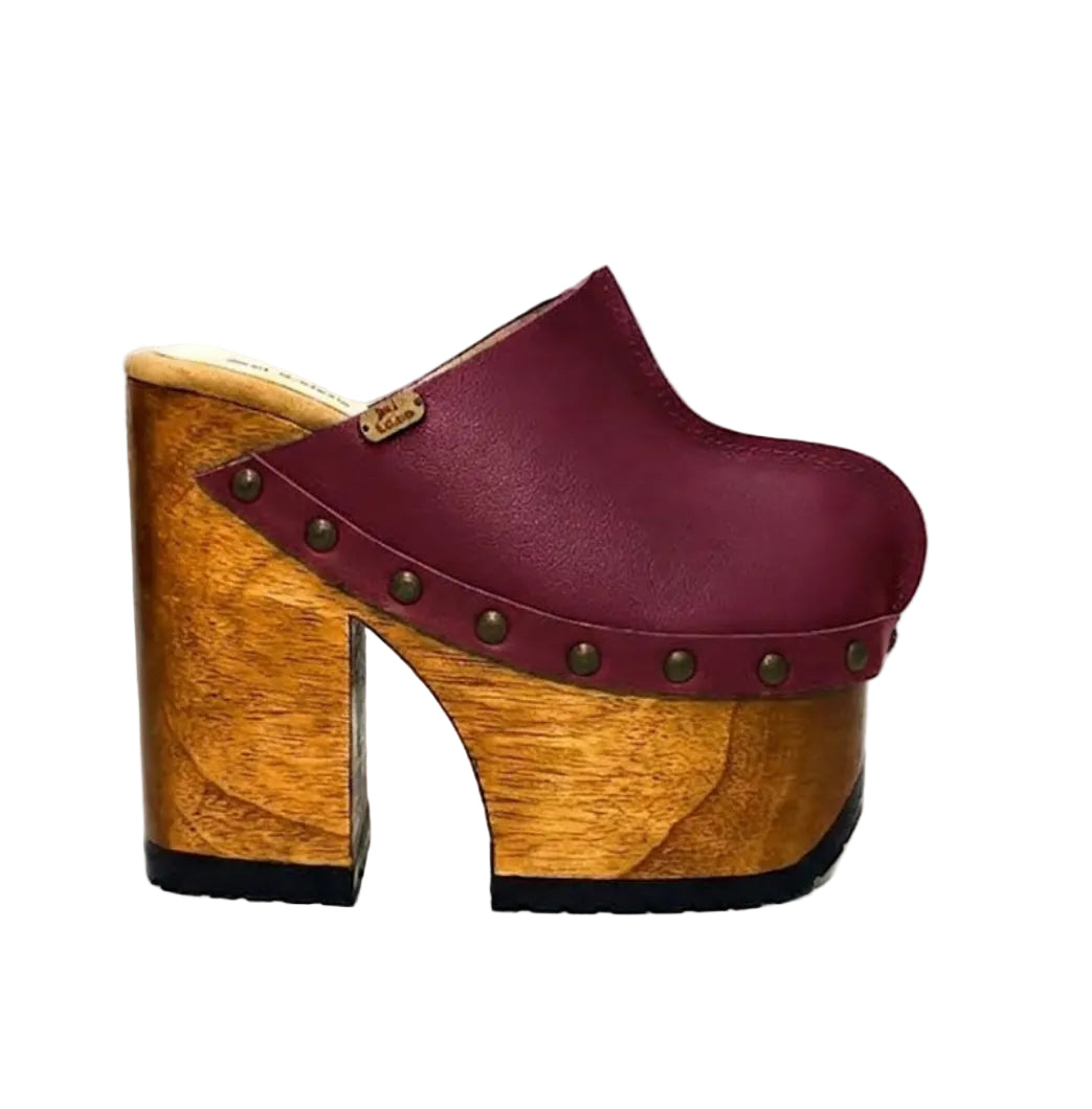 “Blue Jeans” Clogs by Sol Caleyo: side view of Bordeaux-colored leather platform clogs.