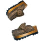 Pair of handcrafted wooden platform clogs in distressed brown leather, lacquered wood and lugged rubber sole