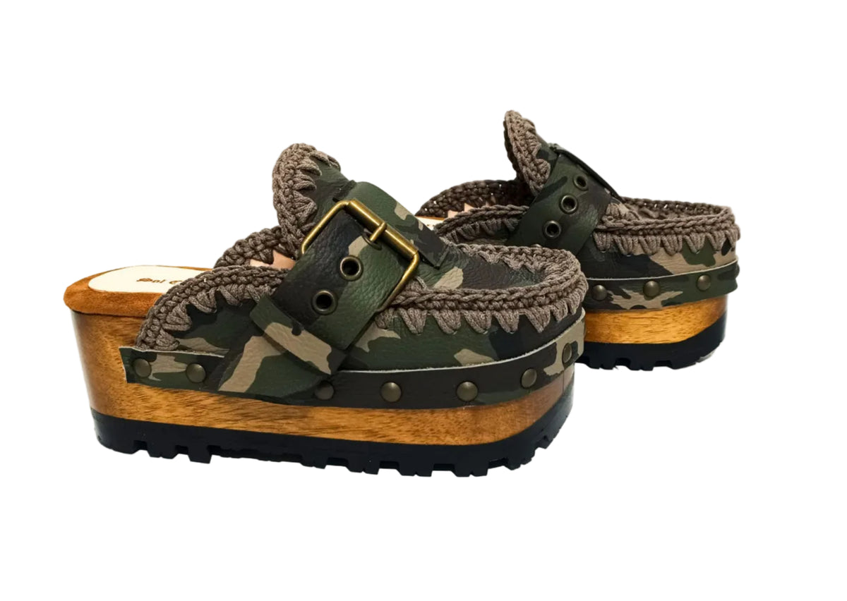 Handcrafted military camouflage and brown leather platform clog with unique crochet stitch edging and antique gold buckle detailing on a sturdy wooden base with a rugged black rubber outsole.