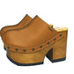 Brown leather clogs in a vintage 70s style. Super high vintage-style wooden heel. Sizes 33 to 47. High-end footwear handmade by Sol Caleyo.