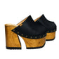 Black leather clogs in a vintage 70s style. Super high vintage-style wooden heel. Sizes 33 to 47. High-end footwear handmade by Sol Caleyo.