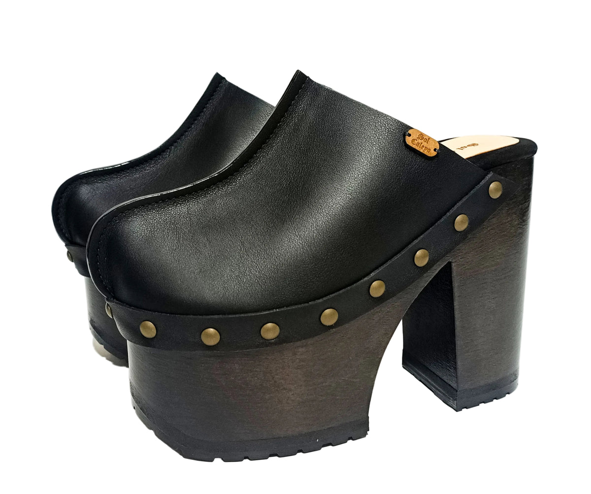 Black leather clogs with platform and super high heel. Leather mule with super high wooden heel. Black leather clogs 70's vintage style. Vintage style super high heel clogs. Sizes 34 to 47. High quality leather shoes handmade by sol Caleyo. Sustainable fashion.
