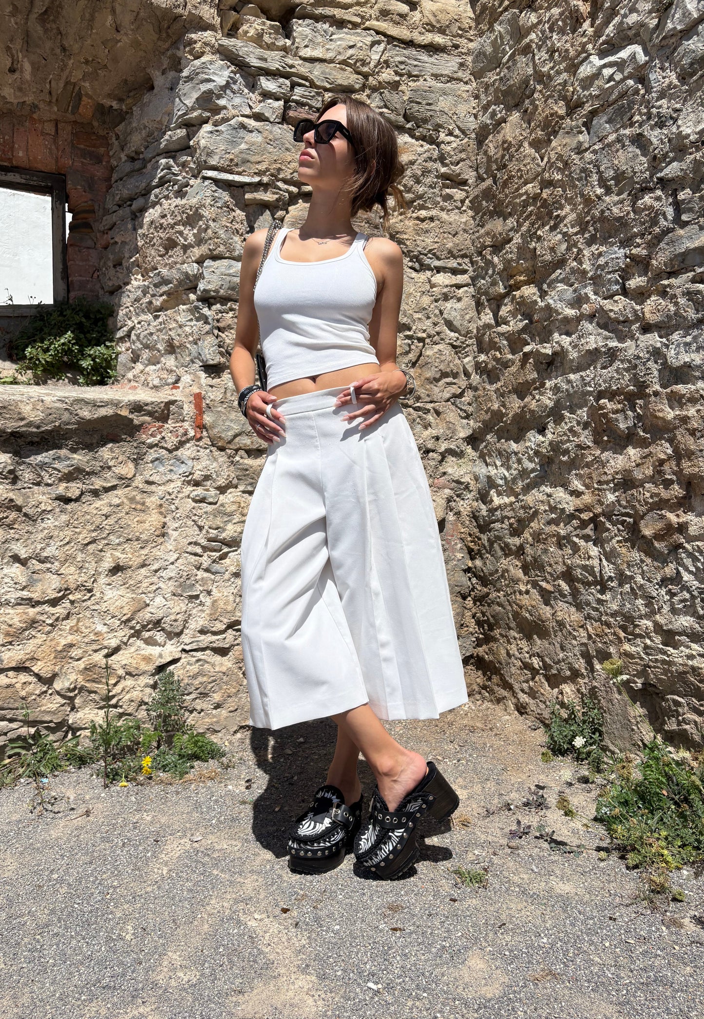 Zebra leather mules with wooden heels. Zebra clogs made from premium quality leather. High-end footwear handmade by Sol Caleyo.