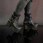 Black leather platform boots with silver studs. Black leather biker style boots with buckles. Black leather ankle boots with vintage style buckles. Leather boots with wooden heel. High-end handmade footwear by Sol Caleyo.
