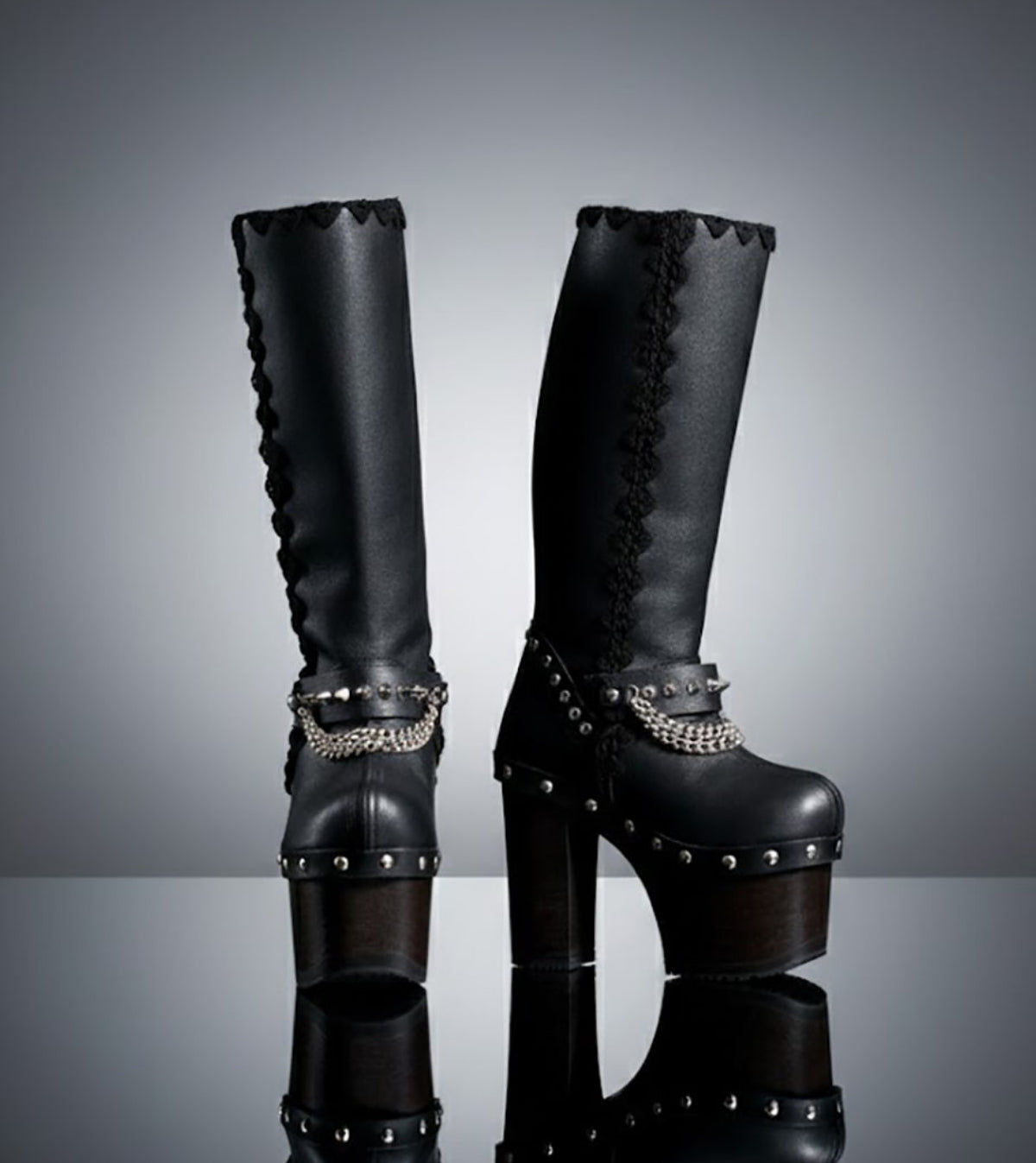 Handmade leather platform boots with silver pyramid studs, chains and 15 cm wenge wooden heel by Sol Caleyo