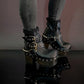 Black leather platform boots with silver studs. Black leather biker style boots with buckles. Black leather ankle boots with vintage style buckles. Leather boots with wooden heel. High-end handmade footwear by Sol Caleyo.