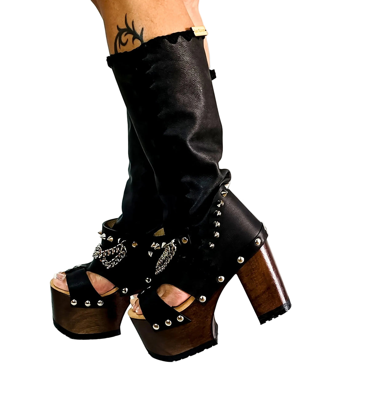 Black platform sandal with super high heel. Black super high heel platform boot with studs and silver chains. Super high heel biker style boot. Sizes 34 to 47. Handmade leather shoes by sol Caleyo.