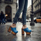 Model walking in Sol Caleyo blue leather platform clogs, street style outfit