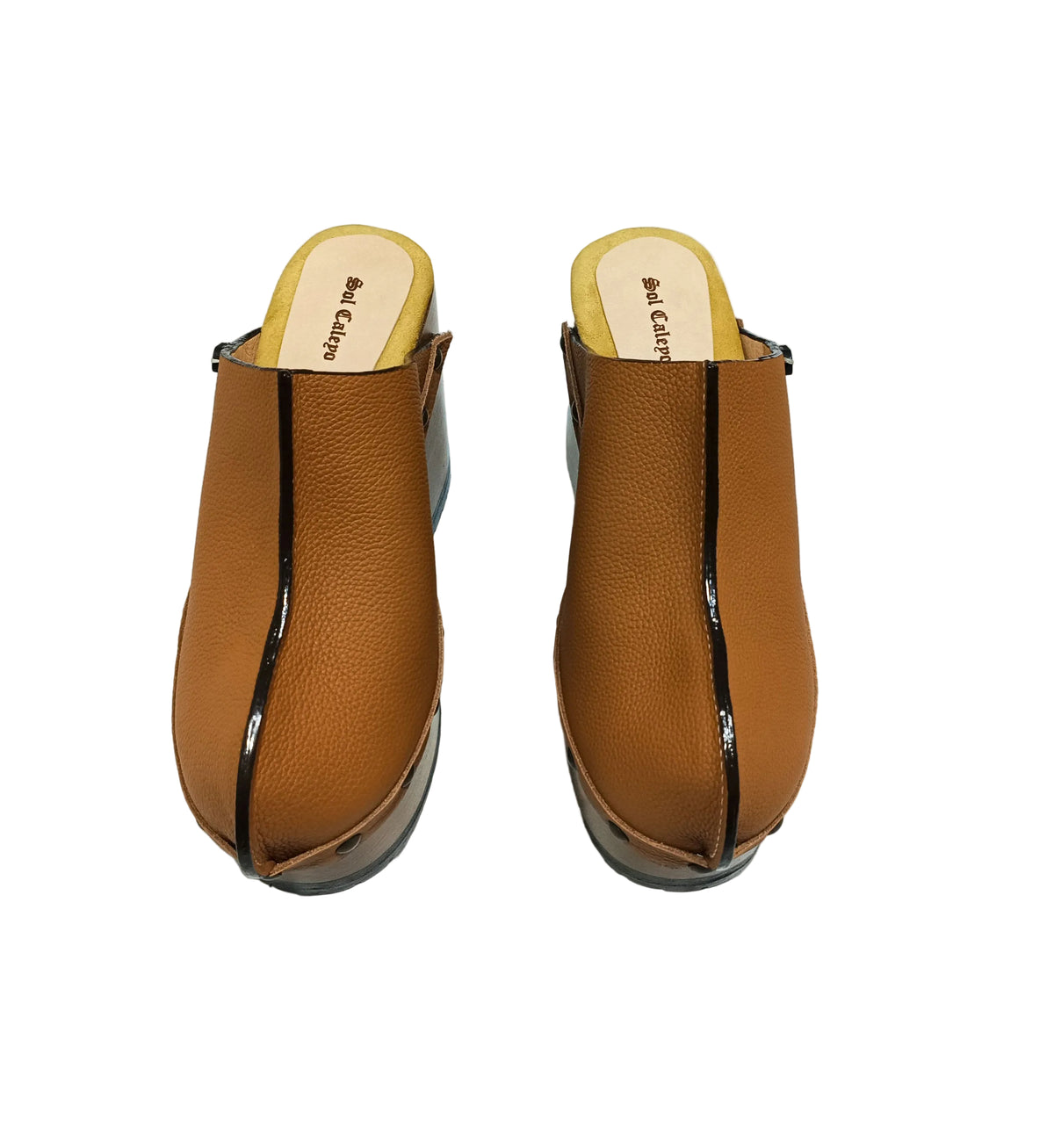 Brown leather clogs in a vintage 70s style. Super high vintage-style wooden heel. Sizes 33 to 47. High-end footwear handmade by Sol Caleyo.