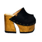 Black leather clogs in a vintage 70s style. Super high vintage-style wooden heel. Sizes 33 to 47. High-end footwear handmade by Sol Caleyo.