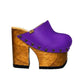“Blue Jeans” Clogs by Sol Caleyo: side view of purple leather platform clogs.