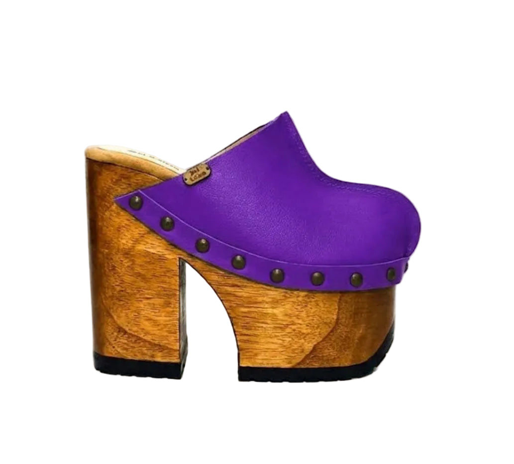 “Blue Jeans” Clogs by Sol Caleyo: side view of purple leather platform clogs.