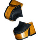 Black leather clogs in a vintage 70s style. Super high vintage-style wooden heel. Sizes 33 to 47. High-end footwear handmade by Sol Caleyo.