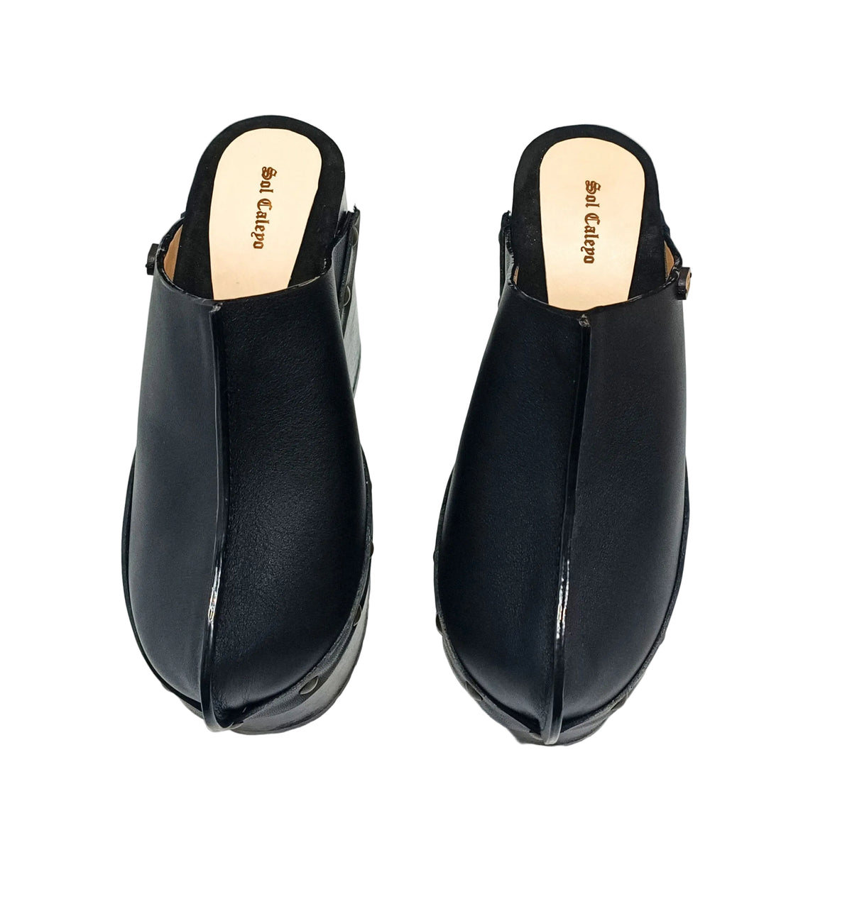 Black leather clogs with platform and super high heel. Leather mule with super high wooden heel. Black leather clogs 70's vintage style. Vintage style super high heel clogs. Sizes 34 to 47. High quality leather shoes handmade by sol Caleyo. Sustainable fashion.