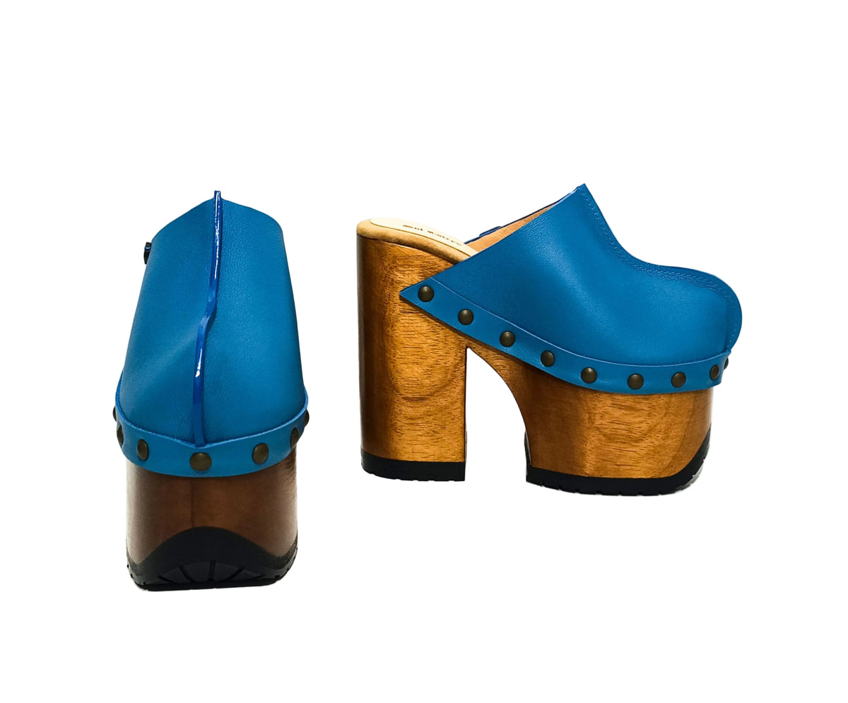Sol Caleyo blue clogs front view showing rounded toe design
