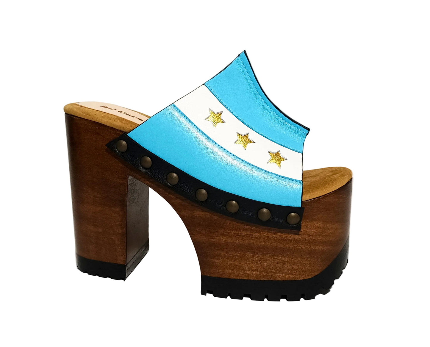 Pair of Sol Caleyo Argentina Sandals featuring a handcrafted wooden block heel and platform, a blue and white leather strap designed as the Argentine flag with three gold stars, and antique gold studs.