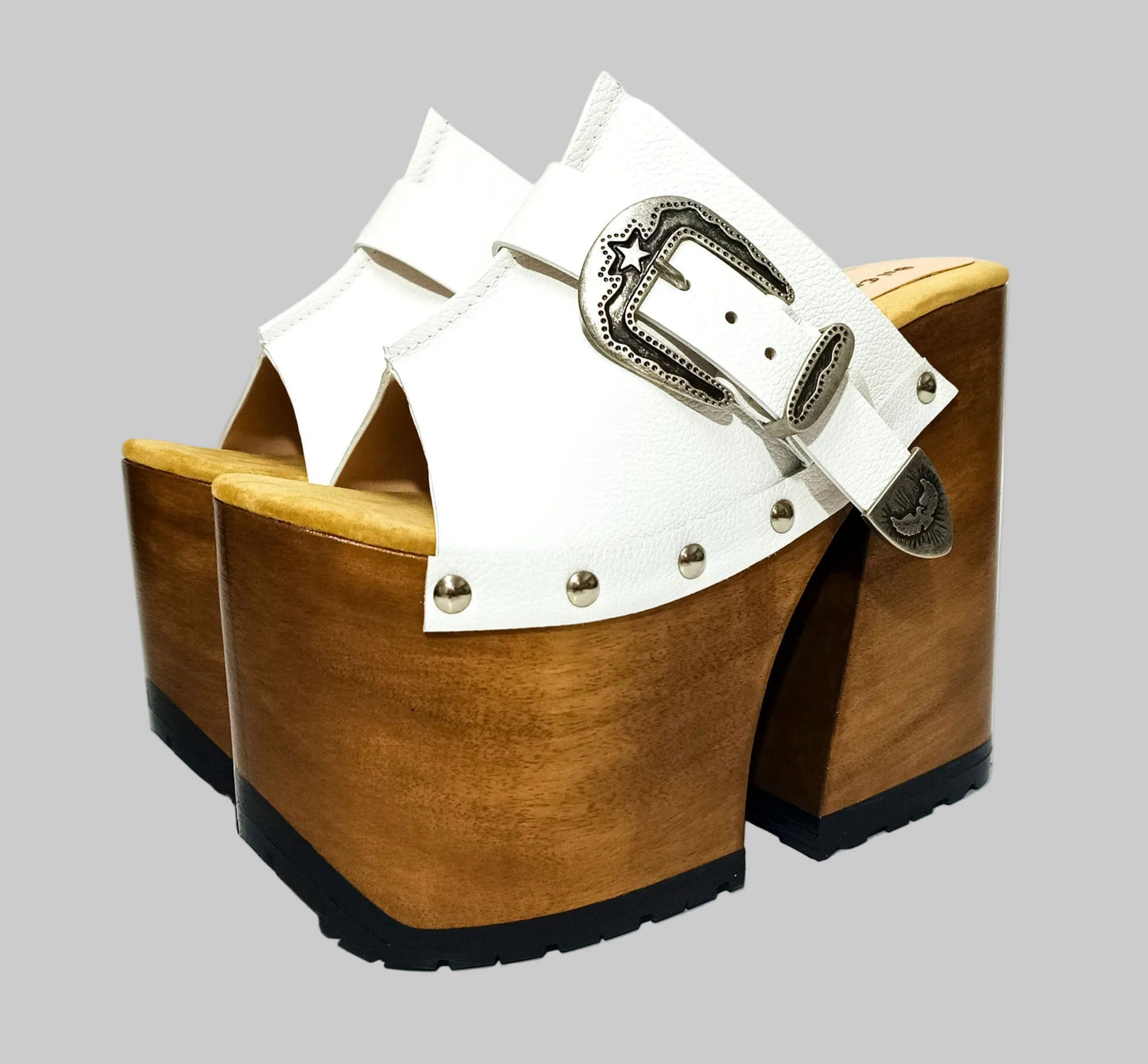 Individually handcrafted White Western Sandals showing the 17cm hand-carved wooden platform and ornate silver buckle on a white background.