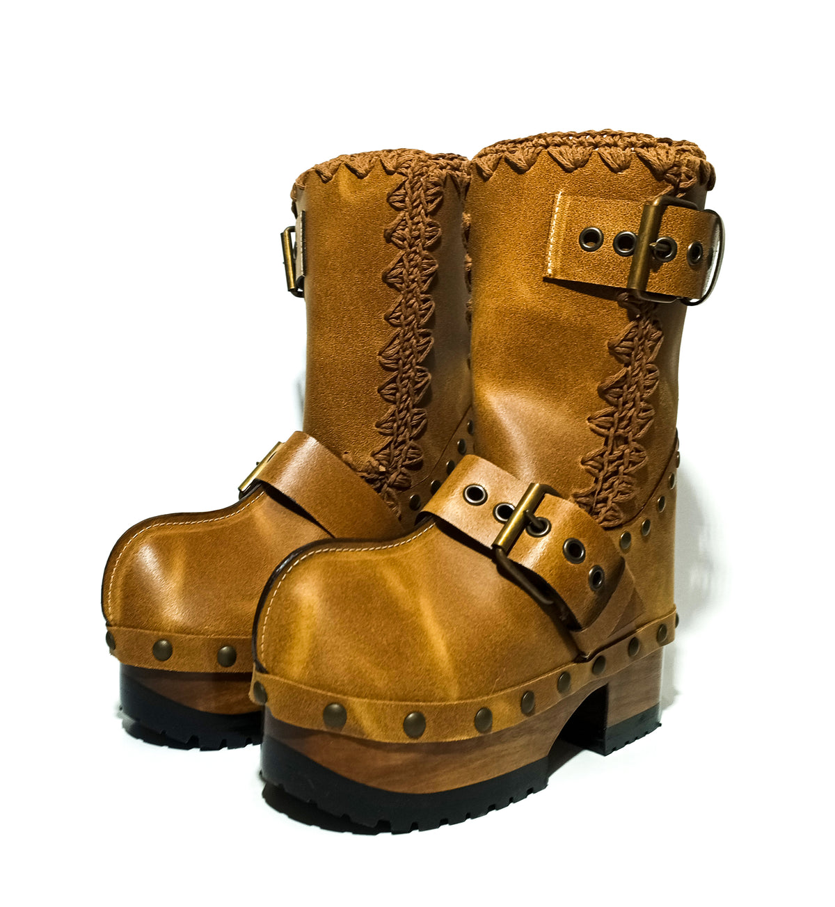 Handmade camel distressed leather pull-on mid-calf platform boots with antique gold buckles, rivets and 6.5 cm lacquered wooden heel by Sol Caleyo.