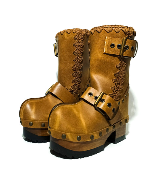 Handmade camel distressed leather pull-on mid-calf platform boots with antique gold buckles, rivets and 6.5 cm lacquered wooden heel by Sol Caleyo.