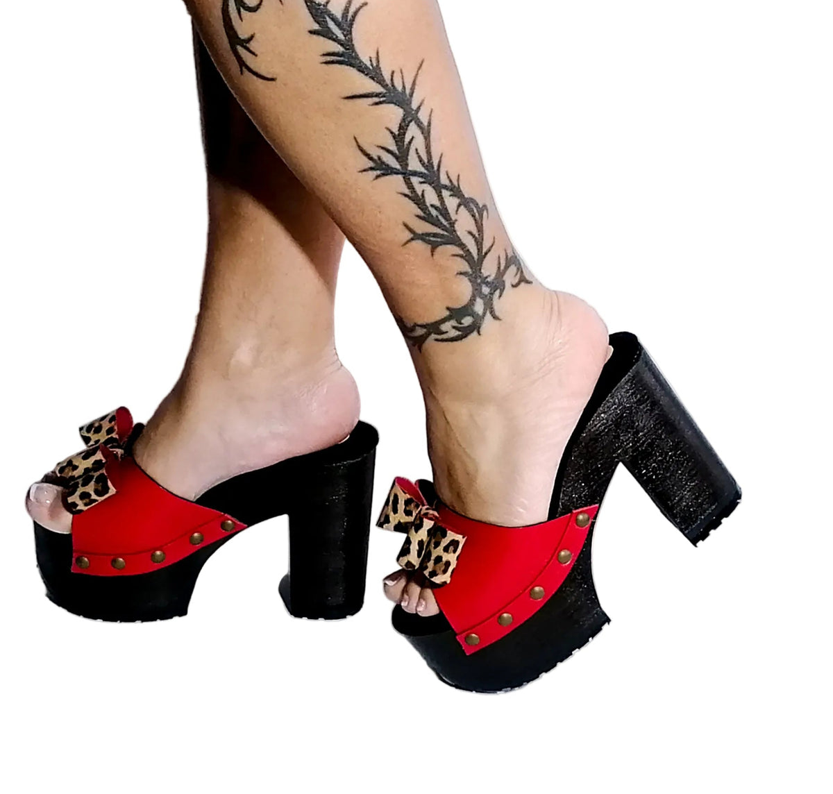 Handmade smooth red leather peep toe platform mule sandals with leopard print leather bow, old-gold studs and 12 cm straight wenge lacquered wooden heel by Sol Caleyo.