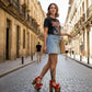 Handmade smooth red leather open toe platform sandals with red leather bow over the toes, ankle strap, old-gold studs and 17 cm straight natural lacquered wooden heel by Sol Caleyo.