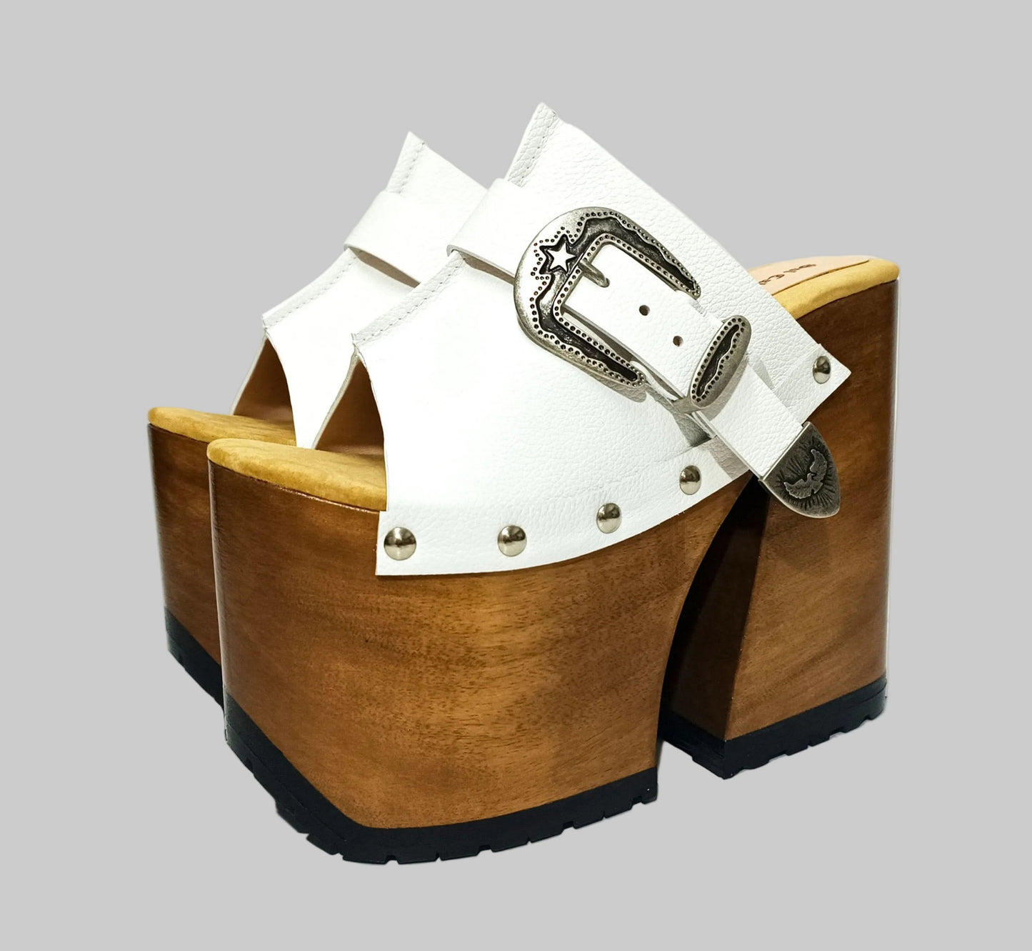 Individually handcrafted White Western Sandals showing the 17cm hand-carved wooden platform and ornate silver buckle on a white background.